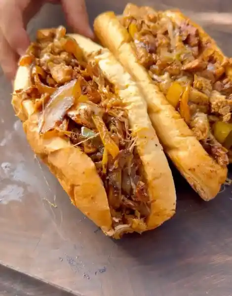 Artisan Chicken Cheesesteak Sandwich: Savory Melt & Caramelized Onions